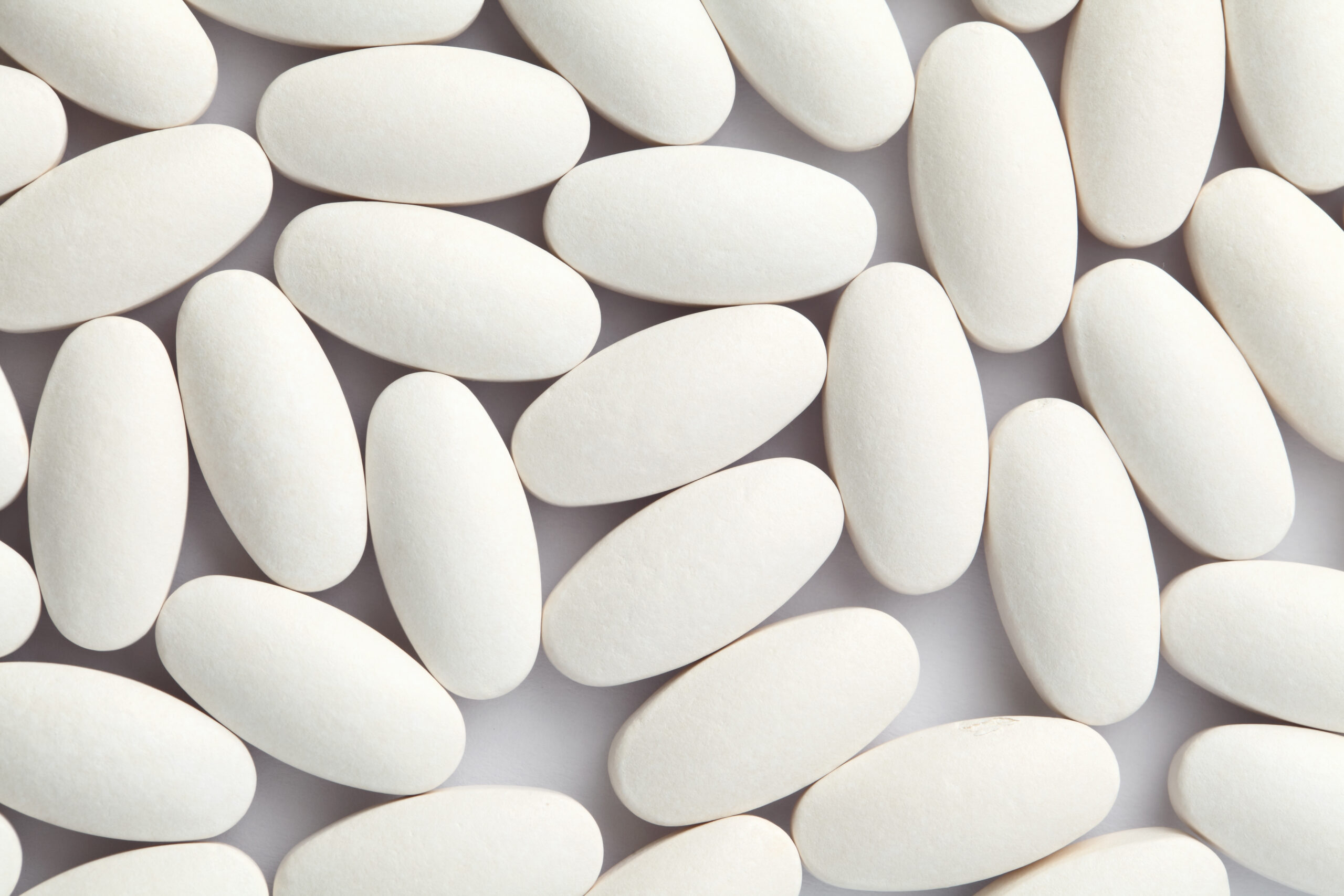 m365 pills white spread across a white background