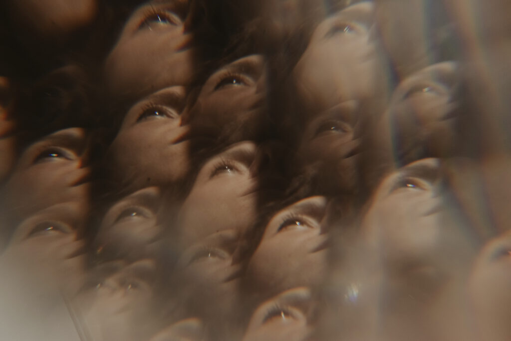 a kaleidoscopic vision of faces converging to represent "what is tweaking"