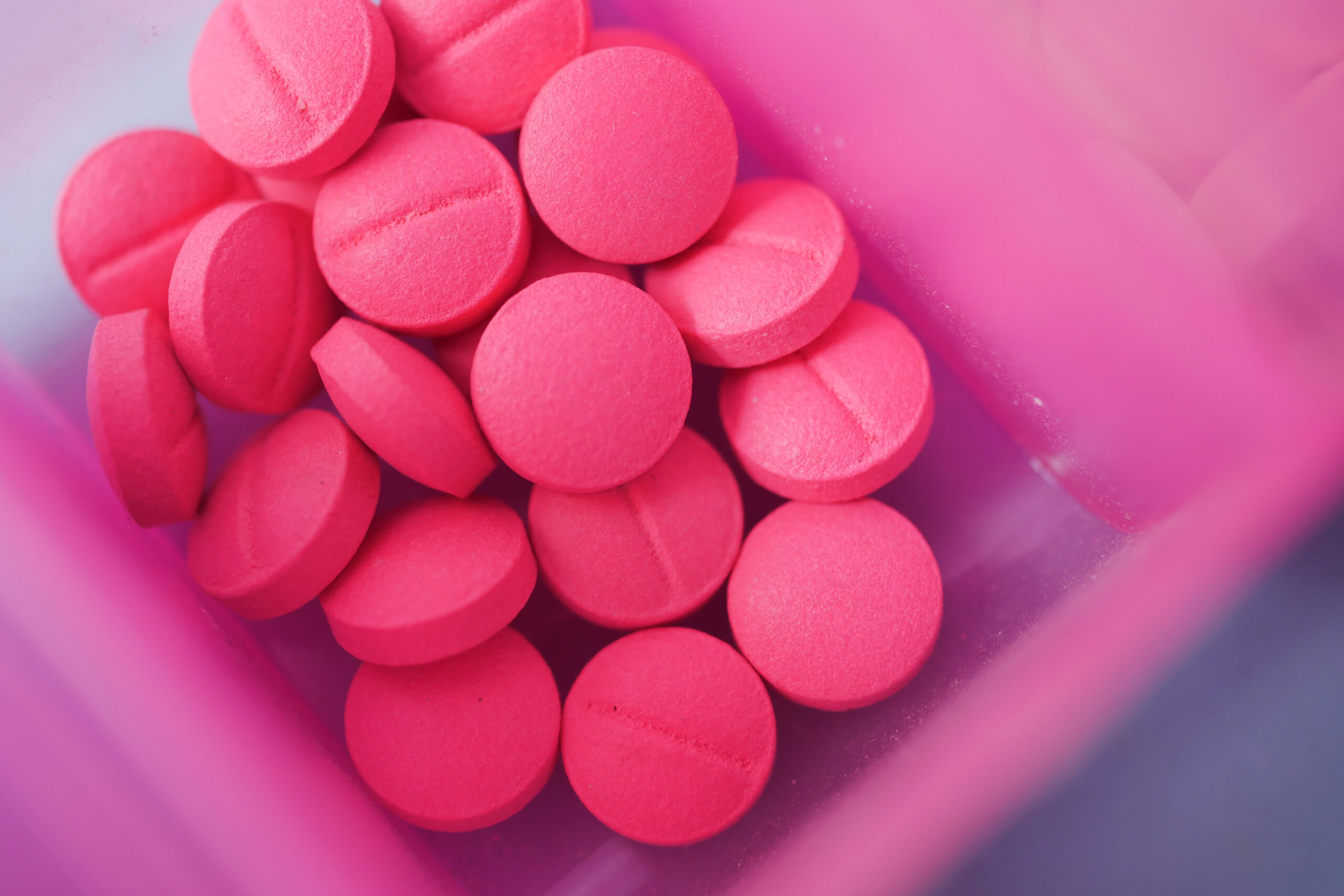 close up of k56 pink opioid pills
