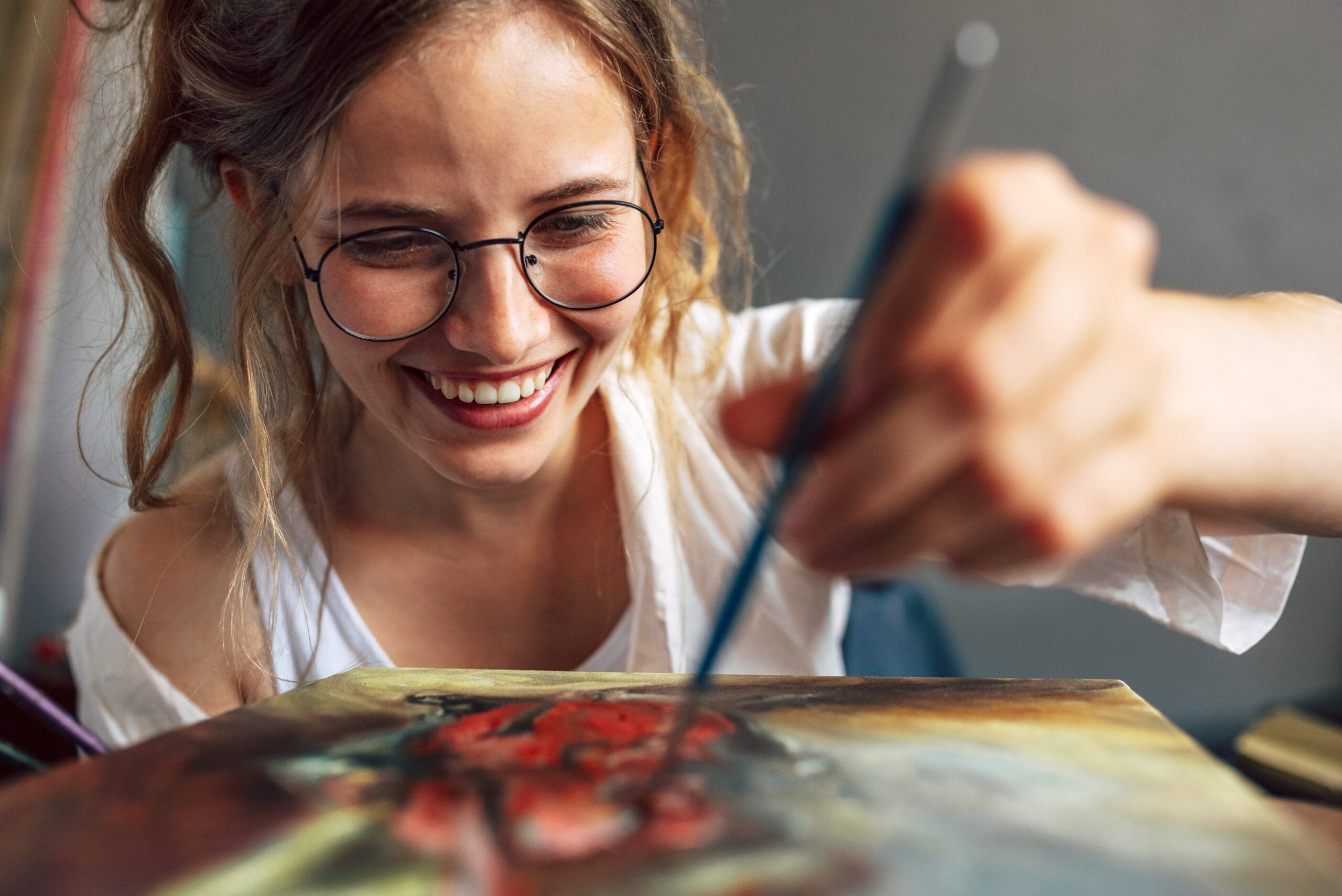 creative art therapy session with individual painting on canvas