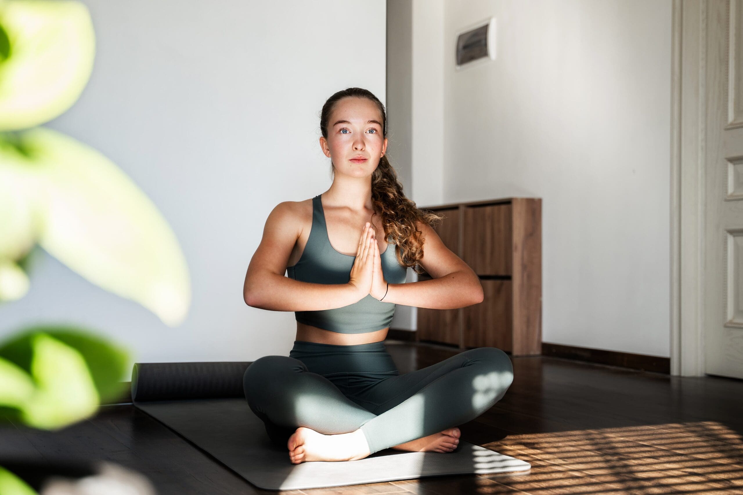 person practicing meditation in a peaceful recovery center setting