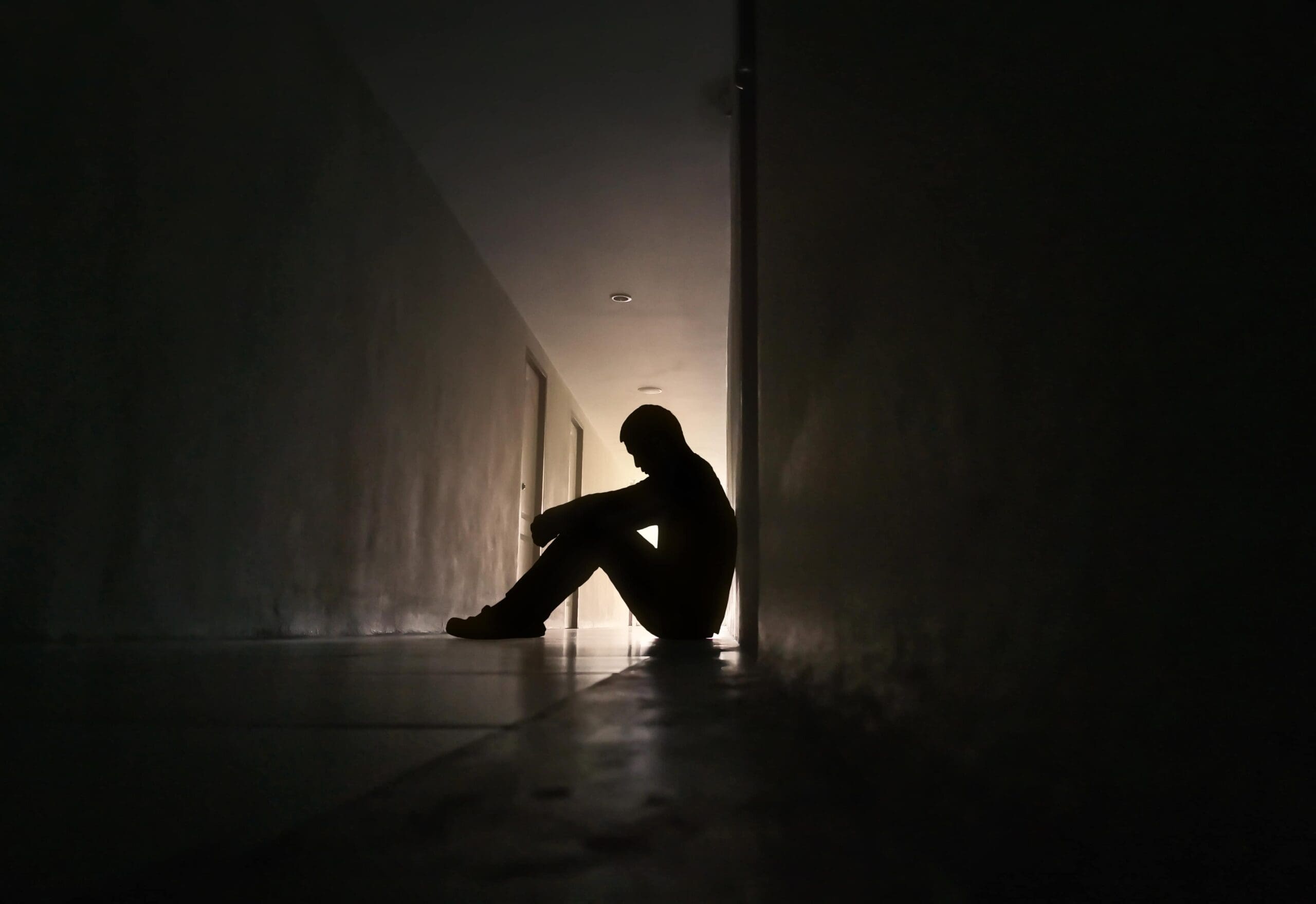 individual struggling with emotional barriers to addiction treatment