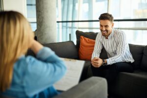 Professional staff member speaking with a patient, symbolizing quality treatment regardless of regional cost.