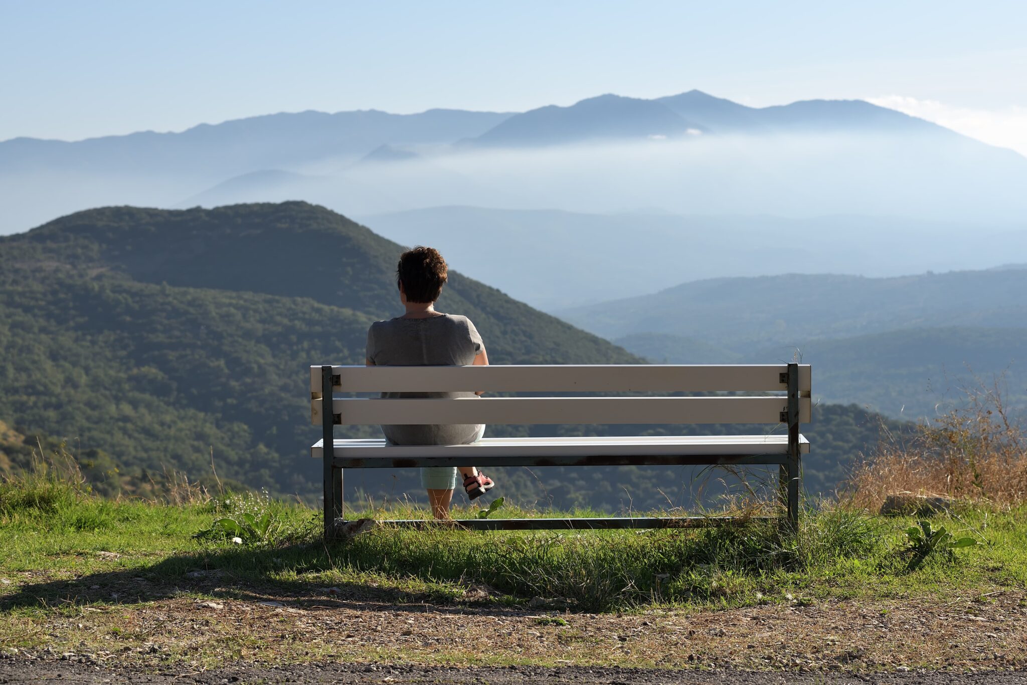 Practicing digital minimalism for mental health in a peaceful outdoor setting.