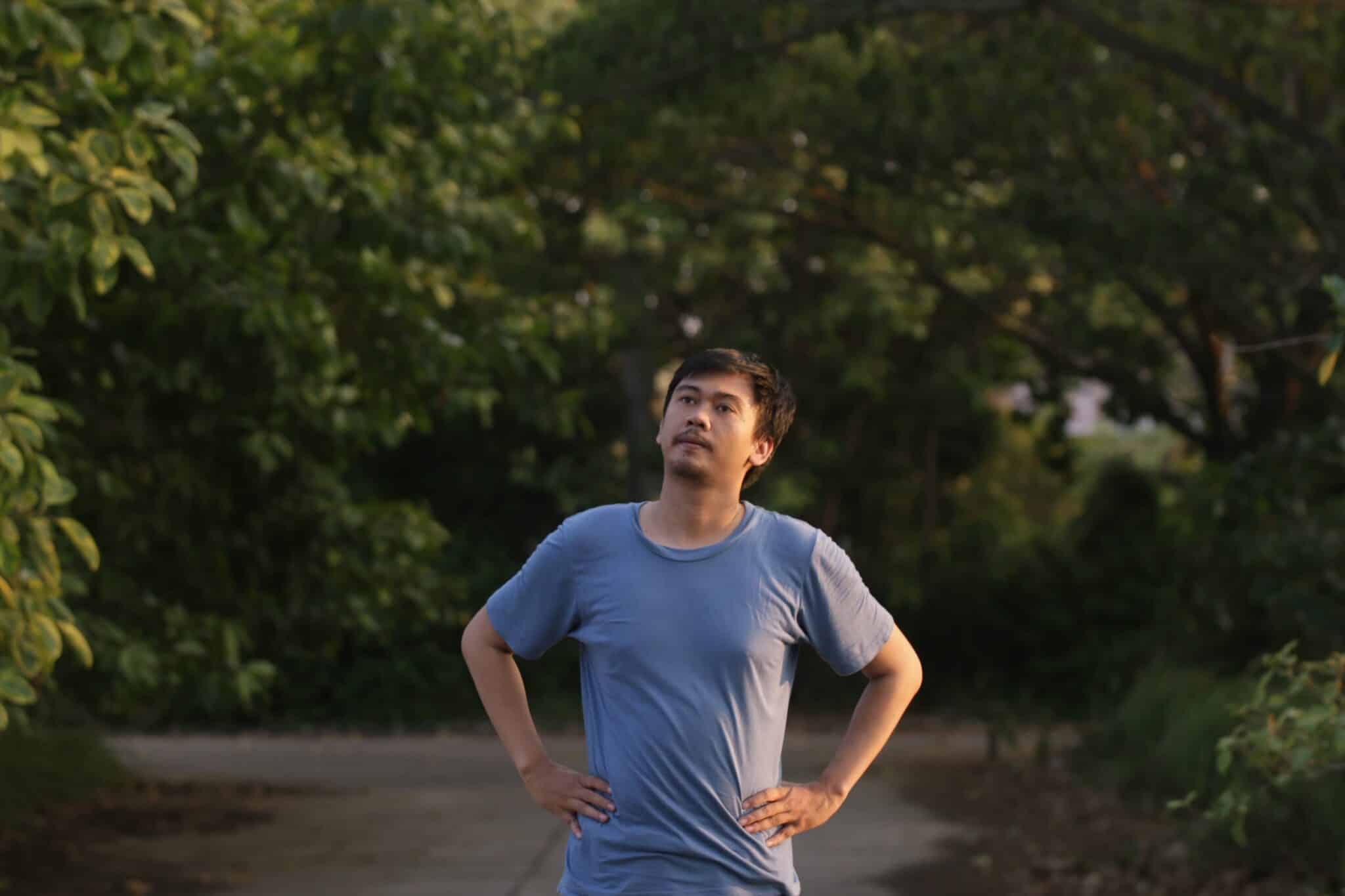 Person reflecting on managing anger as a trigger in recovery